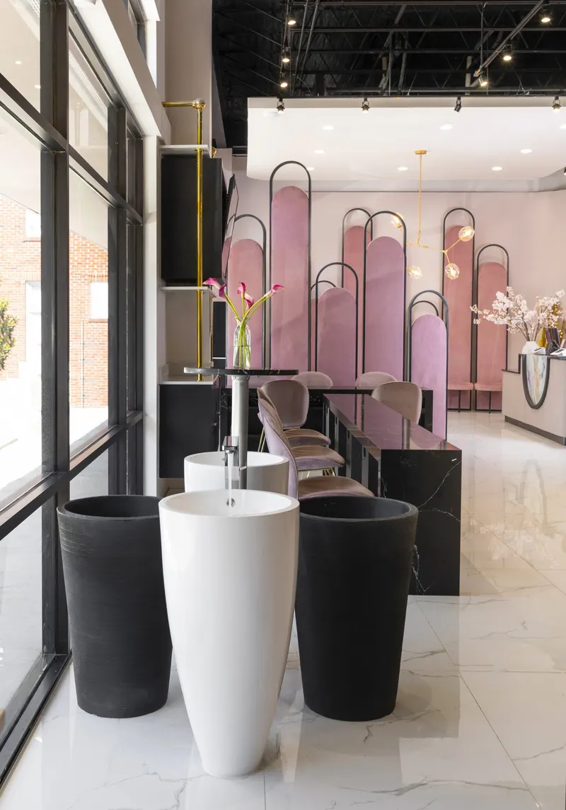 Sculptural sink stations framed by arches