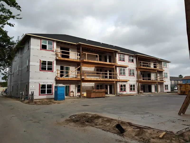 Rama Estates during framing, with wood balconies