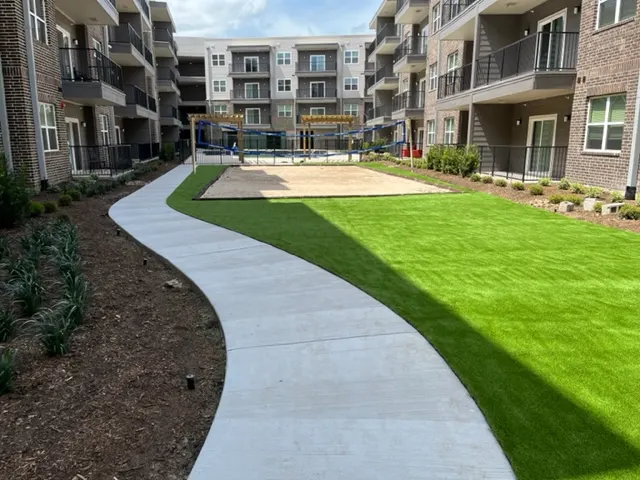 Landscaped courtyard walk and lawn