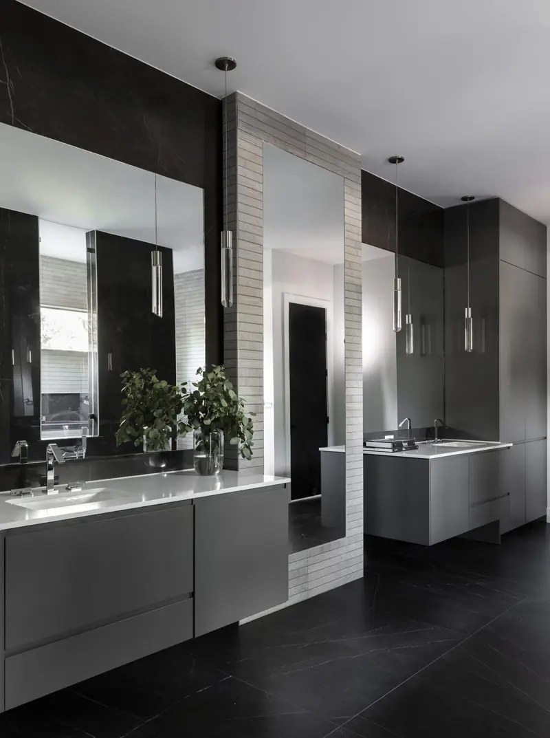 Primary bath with dark cabinetry and a floating vanity