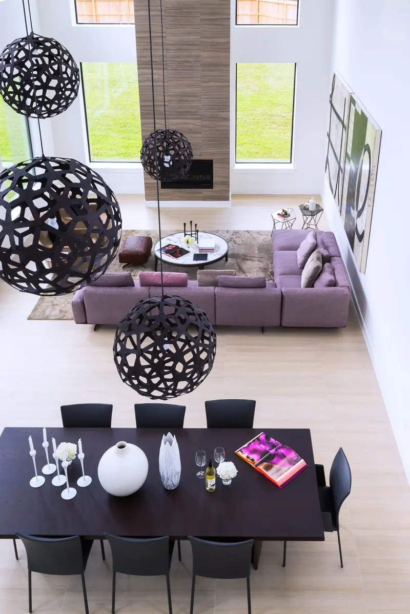 Dining room under sculptural pendants seen from above