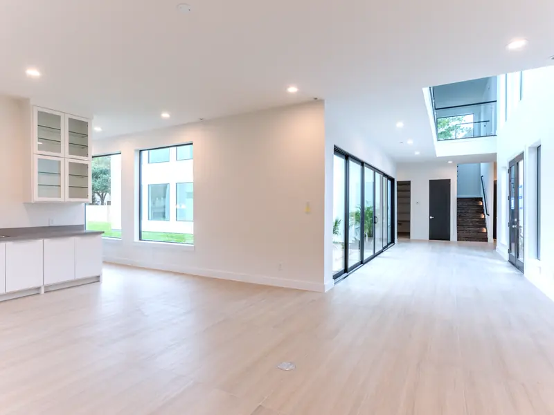 Open living area flowing to the kitchen and courtyard