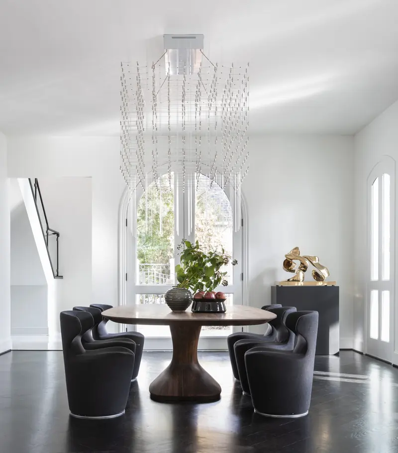 Breakfast nook under a cascading crystal chandelier