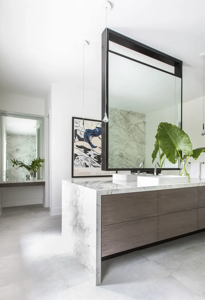 Primary bath with a floating vanity and suspended mirror