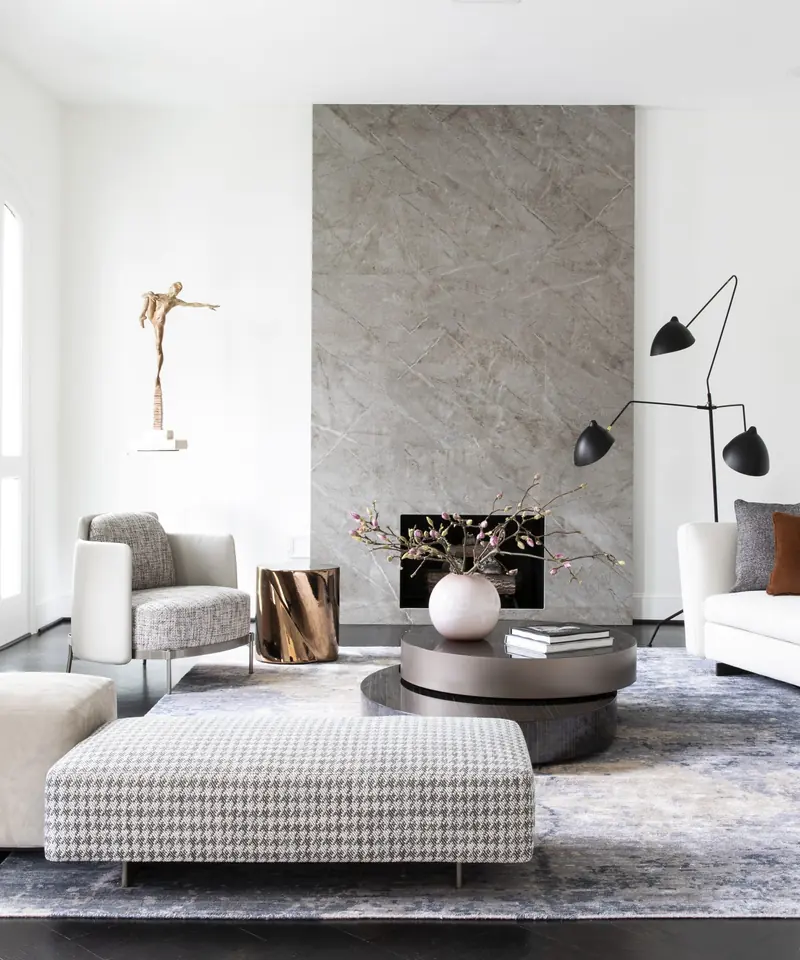 Sitting area with a floor-to-ceiling stone fireplace surround