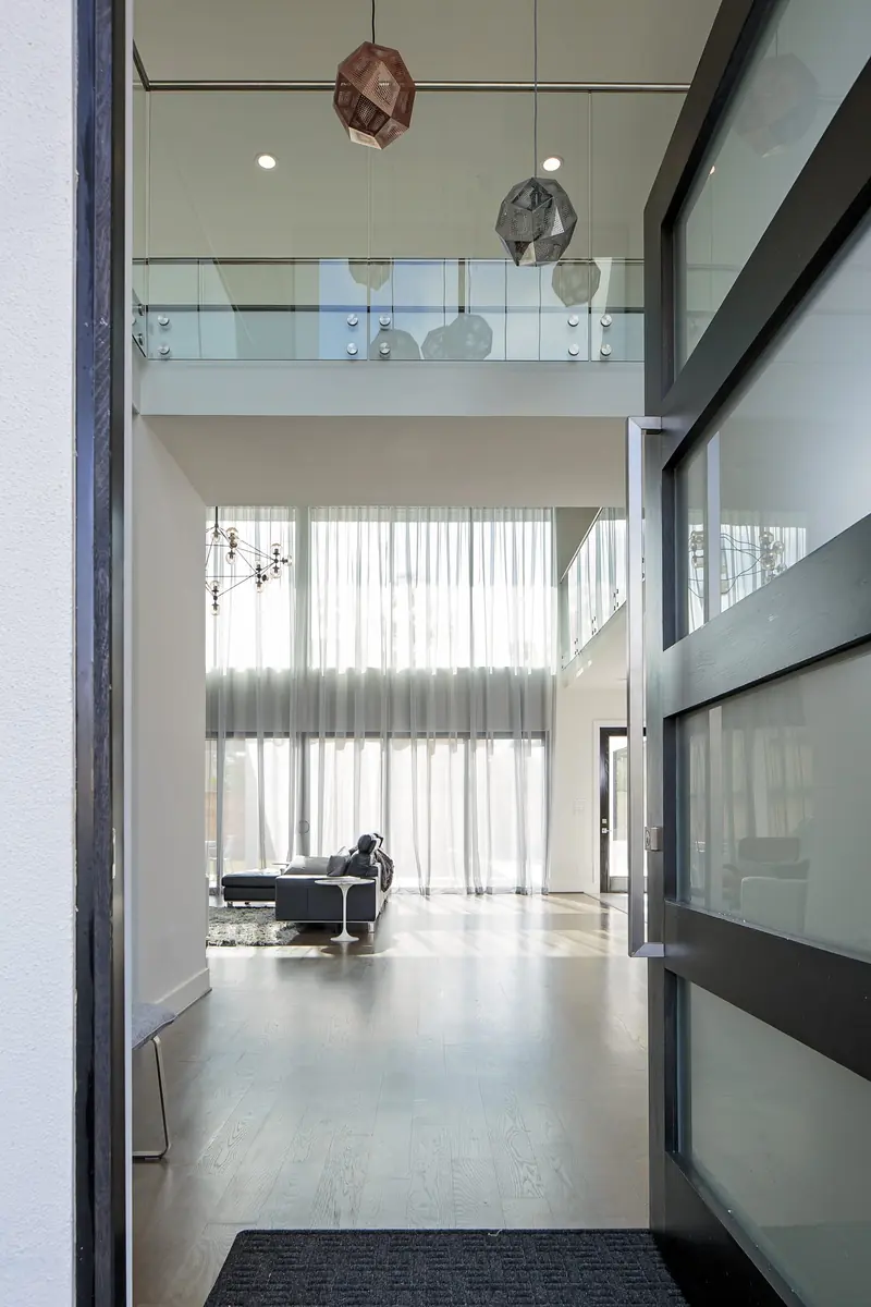 Entry hall with a view through to the double-height living room