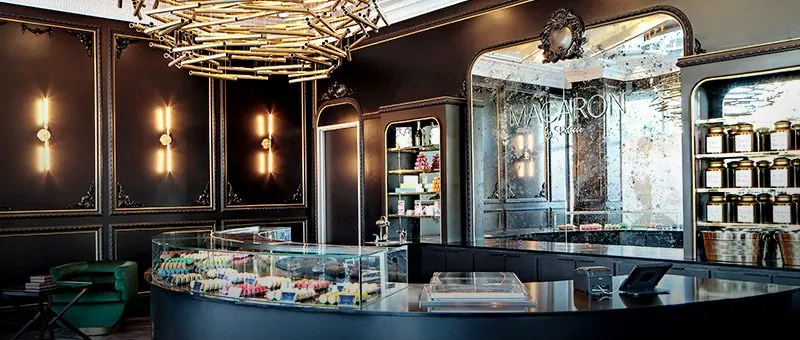 Commercial interior with sculptural chandelier and display counter