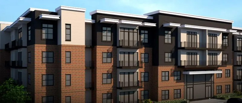Four-story brick and stucco multifamily building