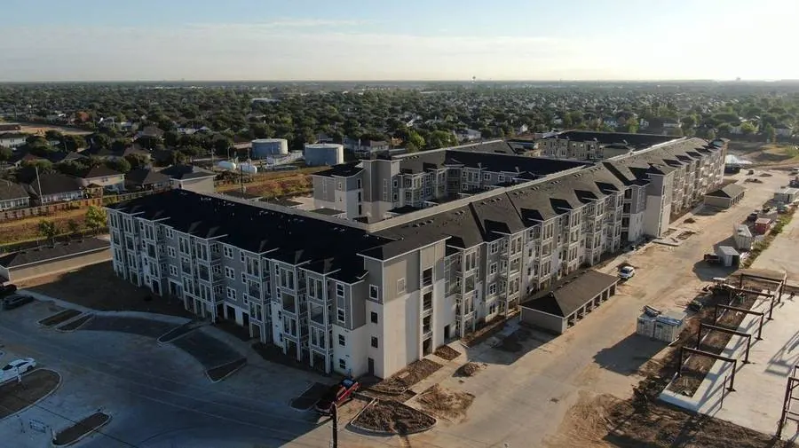 Aerial view of the Queenston four-story apartment community in Cy-Fair, Houston
